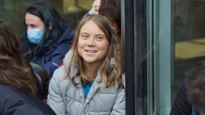 Climate activist Greta Thunberg, center, joins protesters from Fossil Free London in a demonstration outside J.P.Morgan's Canary Wharf offices as part of the action to disrupt the Energy Intelligence Forum (EIF) summit, a gathering between Shell, Total, Equinor, Saudi Aramco, and other oil giants, in London, Thursday, Oct. 19, 2023 (Lucy North/PA via AP) (AP) Climate activist Greta Thunberg, center, joins protesters from Fossil Free London in a demonstration outside J.P.Morgan's Canary Wharf offices as part of the action to disrupt the Energy Intelligence Forum (EIF) summit, a gathering between Shell, Total, Equinor, Saudi Aramco, and other oil giants, in London, Thursday, Oct. 19, 2023 (Lucy North/PA via AP) (AP)