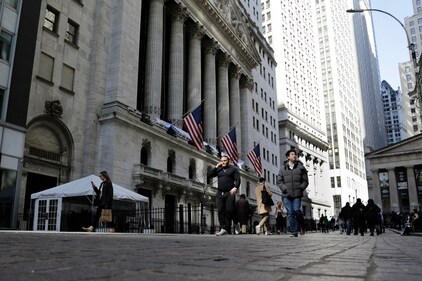 People pass the front of the New York Stock Exchange in New York. (AP)