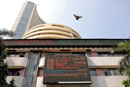 A bird flies past a screen displaying the Sensex results on the facade of the Bombay Stock Exchange on February 1. (Reuters)