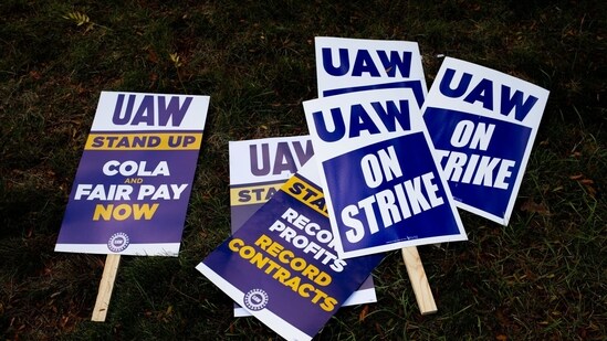A "UAW On Strike" sign held on a picket line outside the Stellantis Sterling Heights Assembly Plant in Sterling Heights, Michigan, US, on Monday, Oct. 23, 2023. UAW union members at Stellantis NVs lucrative pickup truck plant, which makes the Ram 1500 pickup truck, walked off the job Monday morning. (Bloomberg)