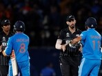 India's Mohammed Shami shakes hands with New Zealand's Daryl Mitchell after India win by 4 wickets