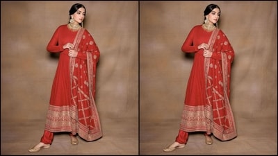 Her outfit features full sleeves, a fitted bodice and a flared bottom with intricate gold embroidery at the bottom. She paired it with a straight legged trouser and a matching duppata embellished with intricate gotta patti work. (Instagram/@sonamkapoor) Her outfit features full sleeves, a fitted bodice and a flared bottom with intricate gold embroidery at the bottom. She paired it with a straight legged trouser and a matching duppata embellished with intricate gotta patti work. (Instagram/@sonamkapoor)