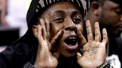 Rapper Lil Wayne shouts during the second half of Game 5 between the Boston Celtics and Miami Heat in their NBA basketball Eastern Conference finals playoffs series in Miami. (AP/Lynne Sladky) Rapper Lil Wayne shouts during the second half of Game 5 between the Boston Celtics and Miami Heat in their NBA basketball Eastern Conference finals playoffs series in Miami. (AP/Lynne Sladky)