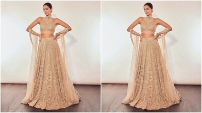Ananya's lehenga attire consisted of a halter-neck blouse with hand-embroidered neckline and intricate sequin detailing. She paired it with a flared lehenga skirt featuring hand-embroidered work in mirrors and sequin embellishments. She paired it with a matching net duppata to complete her look. (Instagram/@tanghavri) Ananya's lehenga attire consisted of a halter-neck blouse with hand-embroidered neckline and intricate sequin detailing. She paired it with a flared lehenga skirt featuring hand-embroidered work in mirrors and sequin embellishments. She paired it with a matching net duppata to complete her look. (Instagram/@tanghavri)