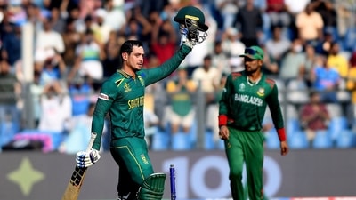 South Africa's Quinton de Kock raises his bat as he celebrates his century during their match against Bangladesh in the ICC Men's Cricket World Cup 2023, at Wankhede Stadium (ANI ) South Africa's Quinton de Kock raises his bat as he celebrates his century during their match against Bangladesh in the ICC Men's Cricket World Cup 2023, at Wankhede Stadium (ANI )