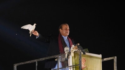 Pakistan's former Prime Minister Nawaz Sharif releases a dove as he arrives to address a welcoming rally in Lahore on October 21. (AP) Pakistan's former Prime Minister Nawaz Sharif releases a dove as he arrives to address a welcoming rally in Lahore on October 21. (AP)