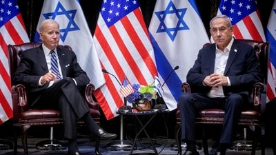 FILE PHOTO: U.S. President Joe Biden, left, pauses during a meeting with Israeli Prime Minister Benjamin Netanyahu, right, to discuss the war between Israel and Hamas, in Tel Aviv, Israel, Wednesday, Oct. 18, 2023.  Miriam Alster/Pool via REUTERS/File Photo (via REUTERS)