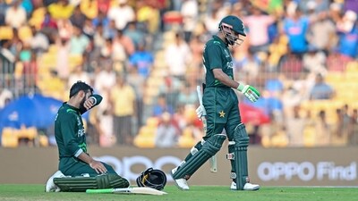 Pakistan's Shadab Khan rests on the ground as his captain Babar Azam (R) walks back to the pavilion (AFP) Pakistan's Shadab Khan rests on the ground as his captain Babar Azam (R) walks back to the pavilion (AFP)