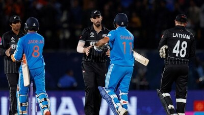 India's Mohammed Shami shakes hands with New Zealand's Daryl Mitchell after India win by 4 wickets (REUTERS)