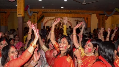 As she returns to her husband's home, devotees give her a grand farewell by smearing sindur on her forehead and feet and offering her betel leave and sweets. (PTI) As she returns to her husband's home, devotees give her a grand farewell by smearing sindur on her forehead and feet and offering her betel leave and sweets. (PTI)