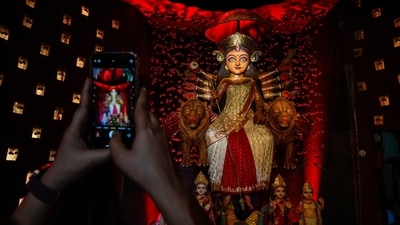 Bengali women wear traditional sarees and jewellery during Sindoor Khela. They first apply sindoor on the Goddess' forehead and feet and then smear sindoor on each other. The ritual promotes bonhomie between the women and spreads happiness and joy. (AP) Bengali women wear traditional sarees and jewellery during Sindoor Khela. They first apply sindoor on the Goddess' forehead and feet and then smear sindoor on each other. The ritual promotes bonhomie between the women and spreads happiness and joy. (AP)