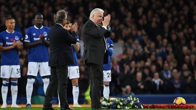 Everton's Iranian owner Farhad Moshiri (L) and Everton's English chairman Bill Kenwright lay a wreath in honour of the victims of the Leicester City helicopter crash ahead of the English Premier League football match (AFP)