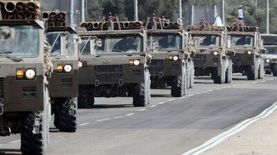 A convoy of Israeli army trucks carrying mortar shells advances on a road near the southern city of Sderot. (AFP) A convoy of Israeli army trucks carrying mortar shells advances on a road near the southern city of Sderot. (AFP)