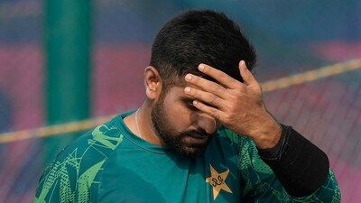 Pakistan's captain Babar Azam reacts as he speaks with batting coach Grant Bradburn during a practice session (AP) Pakistan's captain Babar Azam reacts as he speaks with batting coach Grant Bradburn during a practice session (AP)
