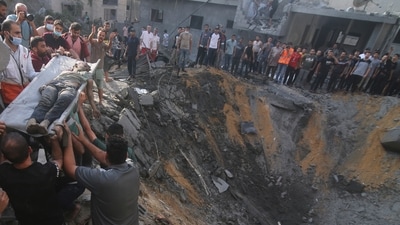Israel-Hamas War: Palestinians pull a boy from the rubble after an Israeli strike on the Zaroub family house in Rafah, Gaza Strip. (AP) Israel-Hamas War: Palestinians pull a boy from the rubble after an Israeli strike on the Zaroub family house in Rafah, Gaza Strip. (AP)