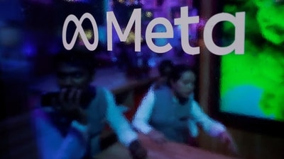FILE PHOTO: People are seen behind a logo of Meta Platforms, during a conference in Mumbai, India, September 20, 2023. REUTERS/Francis Mascarenhas/File Photo (REUTERS)