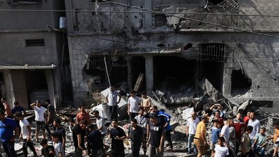 Israel-Hamas War: Rescuers look for survivors in the rubble of a building hit in an Israeli air strike in Khan Yunis in the southern Gaza Strip. (AFP) Israel-Hamas War: Rescuers look for survivors in the rubble of a building hit in an Israeli air strike in Khan Yunis in the southern Gaza Strip. (AFP)