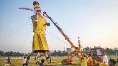 In Patna, a colossal yellow effigy of the demon king Ravan is being installed on the eve of the auspicious Dussehra festival celebrations, at Gandhi Maidan. (PTI photo) In Patna, a colossal yellow effigy of the demon king Ravan is being installed on the eve of the auspicious Dussehra festival celebrations, at Gandhi Maidan. (PTI photo)