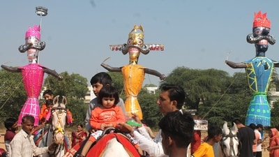Visitors enjoying a horse ride at the Dussehra ground as the effigies of demon king Ravana, Kumbhkaran and Meghnad stand tall for the Vijayadashmi celebrations, in Faridabad. (PTI Photo) Visitors enjoying a horse ride at the Dussehra ground as the effigies of demon king Ravana, Kumbhkaran and Meghnad stand tall for the Vijayadashmi celebrations, in Faridabad. (PTI Photo)