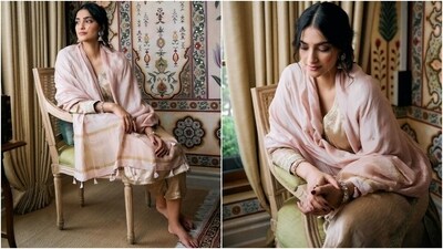 Sonam wore a beauteous cotton silk suit set from the shelves of designer Anita Dongre's eponymous label. The ensemble features a gold embroidered kurta and palazzo set styled with a blush pink dupatta. While the suit features intricate gotta patti embroidery, ribbed design, and hand-embroidered design on the neckline and torso, the dupatta has tassels adorned on the borders and brocade work.&nbsp; (Instagram)
