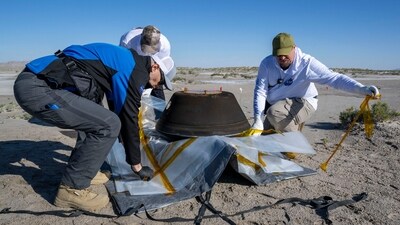 Scientist prepare the sample return capsule from NASA's OSIRIS-REx mission for transport on September 24. (AFP) Scientist prepare the sample return capsule from NASA's OSIRIS-REx mission for transport on September 24. (AFP)