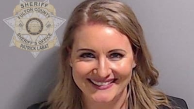 Jenna Ellis is shown in a police booking mugshot released by the Fulton County Sheriff's Office on August 23. (Reuters)