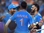 India's Virat Kohli celebrates with KL Rahul, and skipper Rohit Sharma after hitting the winning runs during their match against Bangladesh
