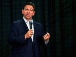 Florida Gov. Ron DeSantis speaks during U.S. Rep. Mariannette Miller-Meeks', R-Iowa, Triple MMM Tailgate event in Iowa City, Iowa on Friday, Oct. 20, 2023. The event featured remarks from several candidates for the Republican Party's nomination for President. (Nick Rohlman/The Gazette via AP)