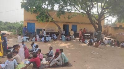 A school conducts classes under trees in Kaman constituency. (HT Photo) A school conducts classes under trees in Kaman constituency. (HT Photo)