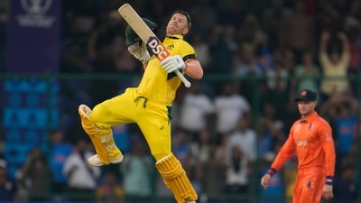 Australia's David Warner leaps to celebrate scoring a century during the ICC Men's Cricket World Cup match between Australia and Netherlands in New Delhi, India (AP) Australia's David Warner leaps to celebrate scoring a century during the ICC Men's Cricket World Cup match between Australia and Netherlands in New Delhi, India (AP)