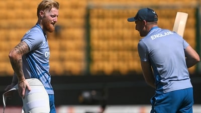 England's captain Jos Buttler (R) speaks with Ben Stokes during a practice session (AFP)
