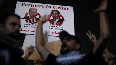 A banner depicting U.S. President Joe Biden and Israeli Prime Minister Benjamin Netanyahu (REUTERS)