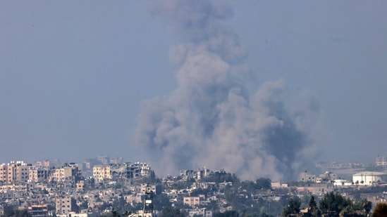 A picture taken from the southern Israeli city of Sderot shows smoke ascending over the northern Gaza Strip following an Israeli strike on October 25, 2023, amid the ongoing battles between Israel and the Palestinian group Hamas. (Photo by RONALDO SCHEMIDT / AFP) (AFP)