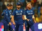 England's Chris Woakes, Jos Buttler and Ben Stokes look dejected after the match 