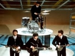 The Beatles, foreground from left, Paul McCartney, George Harrison, John Lennon and Ringo Starr on drums perform on the CBS "Ed Sullivan Show" in New York on  Feb. 9, 1964. Sixty years after the onset of Beatlemania and with two of the quartet now dead, artificial intelligence has enabled the release of a “new” Beatles song.“Now And Then,” will be available Thursday, Nov. 2. (AP Photo/File)