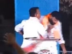The Bharat Rashtra Samithi MLA lunged at the BJP leader and grabbed his throat on live TV