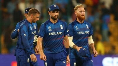 England's Chris Woakes, Jos Buttler and Ben Stokes look dejected after the match (REUTERS)