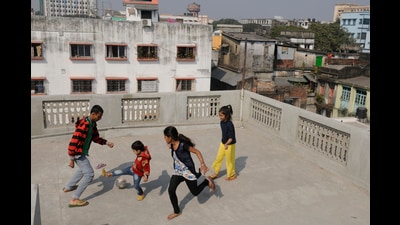 Freedom to be – Children playing football on a roof in North Kolkata. (Samir Jana/HT PHOTO) Freedom to be – Children playing football on a roof in North Kolkata. (Samir Jana/HT PHOTO)