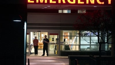 A member of security, center right, stands at an emergency department entrance at Central Maine Medical Center during an active shooter situation in Lewiston, Maine. The shooting is the deadliest mass shooting in the United States since at least May 202. (AP) A member of security, center right, stands at an emergency department entrance at Central Maine Medical Center during an active shooter situation in Lewiston, Maine. The shooting is the deadliest mass shooting in the United States since at least May 202. (AP)