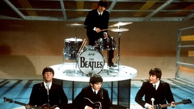 The Beatles, foreground from left, Paul McCartney, George Harrison, John Lennon and Ringo Starr on drums perform on the CBS "Ed Sullivan Show" in New York on Feb. 9, 1964. Sixty years after the onset of Beatlemania and with two of the quartet now dead, artificial intelligence has enabled the release of a “new” Beatles song.“Now And Then,” will be available Thursday, Nov. 2. (AP Photo/File) (AP) The Beatles, foreground from left, Paul McCartney, George Harrison, John Lennon and Ringo Starr on drums perform on the CBS "Ed Sullivan Show" in New York on Feb. 9, 1964. Sixty years after the onset of Beatlemania and with two of the quartet now dead, artificial intelligence has enabled the release of a “new” Beatles song.“Now And Then,” will be available Thursday, Nov. 2. (AP Photo/File) (AP)