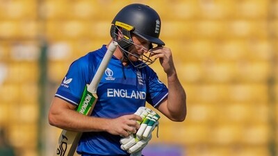 England's batter Jos Buttler walks off the field after his dismissal during the Cricket World Cup 2023 match vs Sri Lanka, at M. Chinnaswamy Stadium, in Bengaluru (PTI)