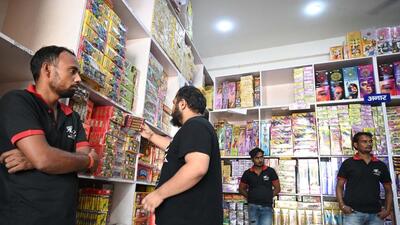 People purchase firecrackers at Gadoli village in Gurugram on Thursday. (Parveen Kumar/HT Photo) People purchase firecrackers at Gadoli village in Gurugram on Thursday. (Parveen Kumar/HT Photo)