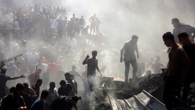 Palestinians inspect the rubble of destroyed buildings following Israeli airstrikes on the town of Khan Younis, southern Gaza Strip, Thursday, Oct. 26, 2023. (AP Photo/Mohammed Dahman) (AP) Palestinians inspect the rubble of destroyed buildings following Israeli airstrikes on the town of Khan Younis, southern Gaza Strip, Thursday, Oct. 26, 2023. (AP Photo/Mohammed Dahman) (AP)
