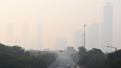 Water was sprinkled through an anti-smog gun in the Anand Vihar area to mitigate pollution.&nbsp; (HT Photo/Sunil Ghosh)