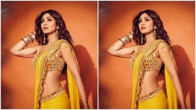 With a yellow embellished blouse in silver mirror work, Shilpa teamed her saree and posed for the cameras. (Instagram/@theshilpashetty) With a yellow embellished blouse in silver mirror work, Shilpa teamed her saree and posed for the cameras. (Instagram/@theshilpashetty)