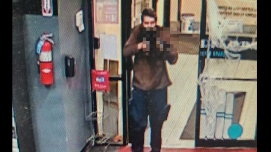 Androscoggin County Sheriff's Office released photos of the alleged suspect carrying a gun, seeking help to identify him (Androscoggin County Sheriff's Office/Facebook)