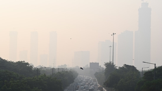 Water was sprinkled through an anti-smog gun in the Anand Vihar area to mitigate pollution.&nbsp;(HT Photo/Sunil Ghosh)