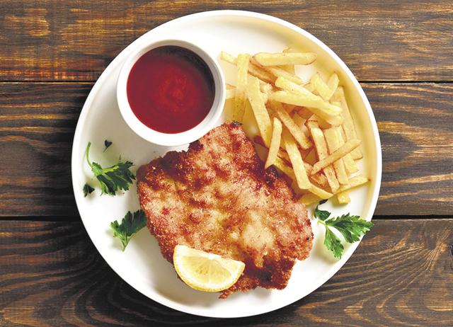In the West, a schnitzel is a flat piece of meat that is breaded and fried. (Adobe Stock) In the West, a schnitzel is a flat piece of meat that is breaded and fried. (Adobe Stock)