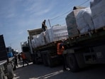 Trucks with humanitarian aid for the 'Gaza Strip enter from Egypt in Rafah on Saturday. (AP) Trucks with humanitarian aid for the 'Gaza Strip enter from Egypt in Rafah on Saturday. (AP)