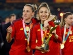 FILE PHOTO: Soccer Football - FIFA Women's World Cup Australia and New Zealand 2023 - Final - Spain v England - Stadium Australia, Sydney, Australia - August 20, 2023 Spain's Olga Carmona and Ona Batlle celebrate with the trophy after winning the World Cup REUTERS/Carl Recine/File Photo
